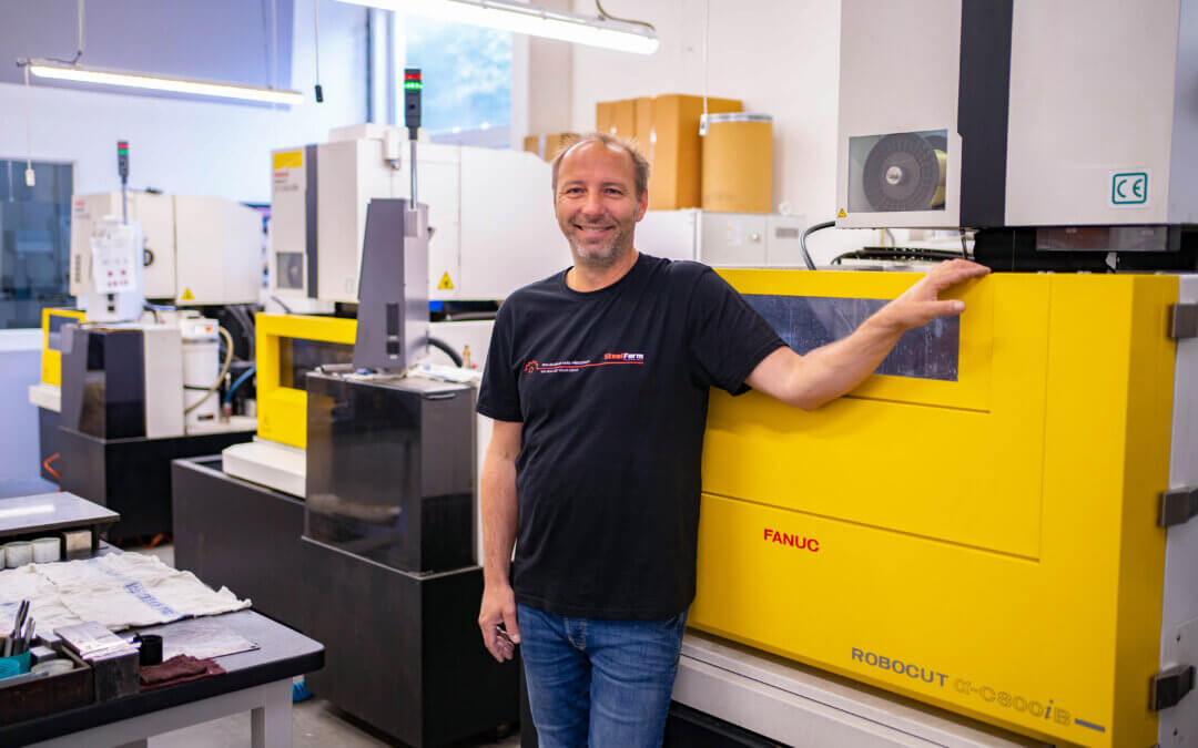 A complete line of FANUC ROBOCUT wire cutters at one workplace